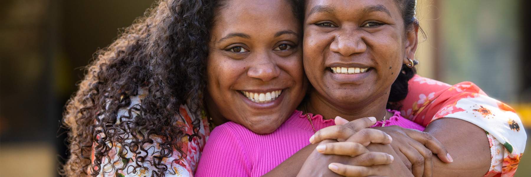 Mother and daughter hugging