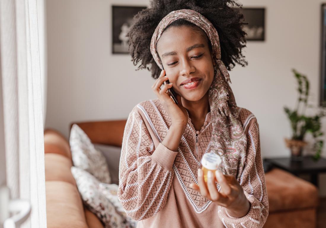 Woman taking medication for endo symptoms