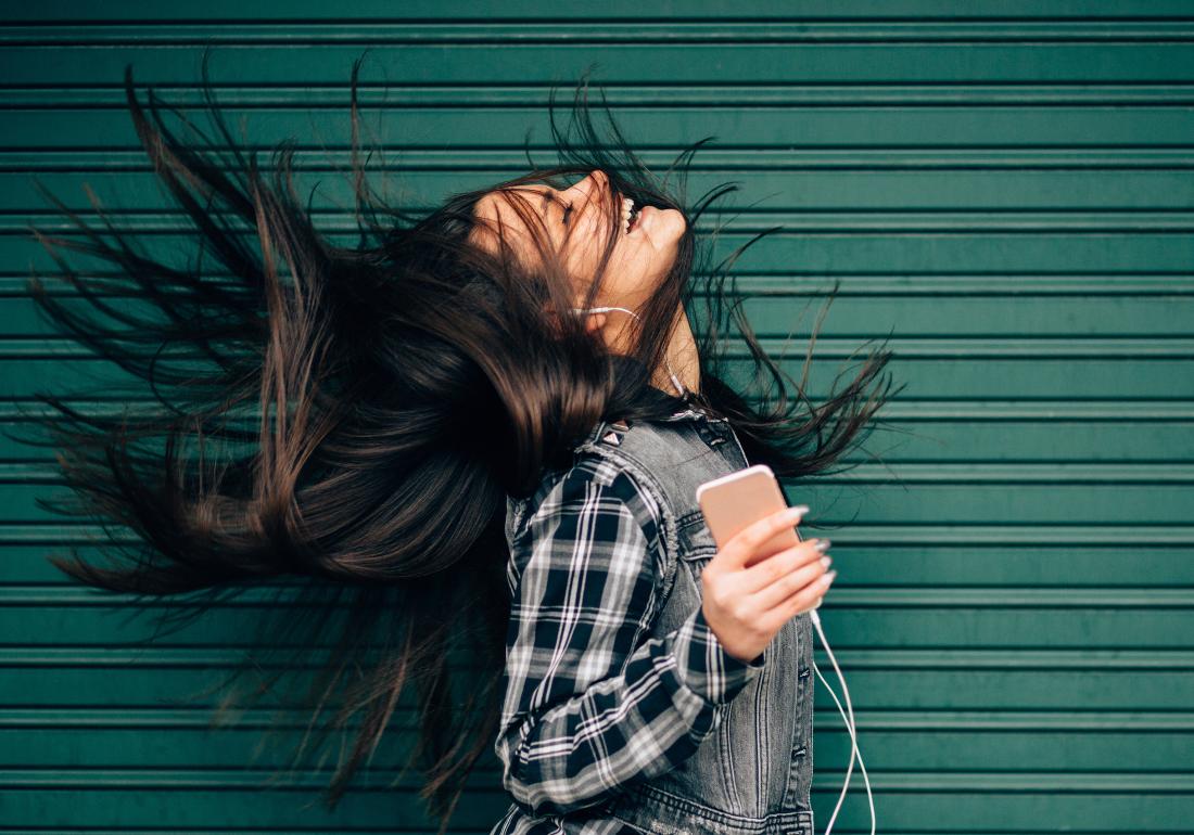 Happy person with diagnosis listening to phone