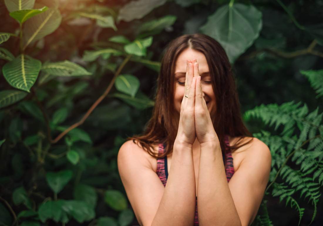 Woman meditating for endo symptoms
