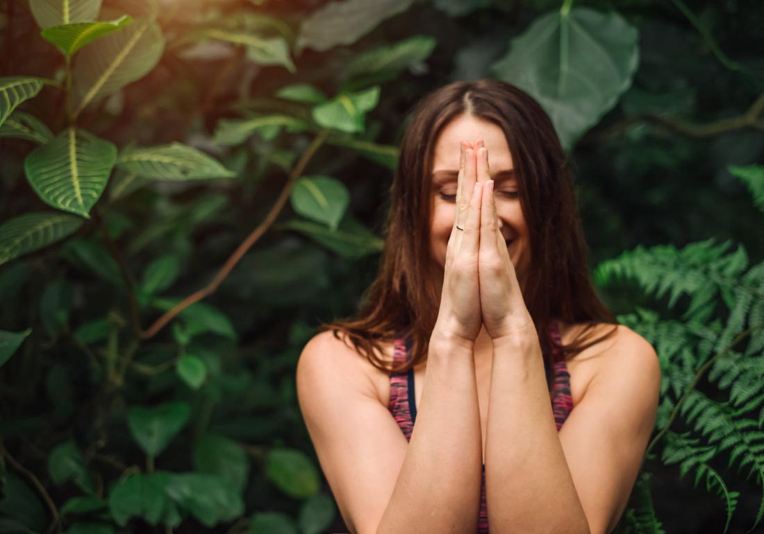 Woman meditating for endo symptoms