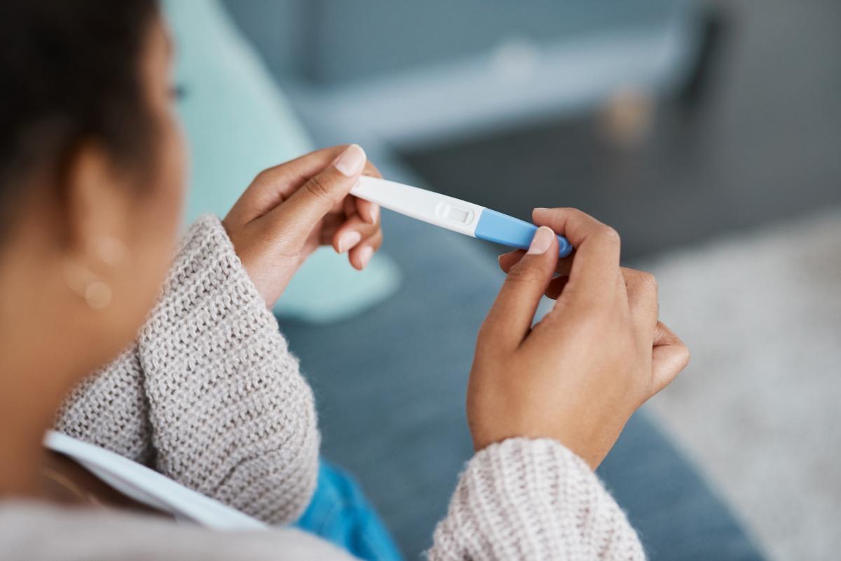 Woman checking pregnancy test 