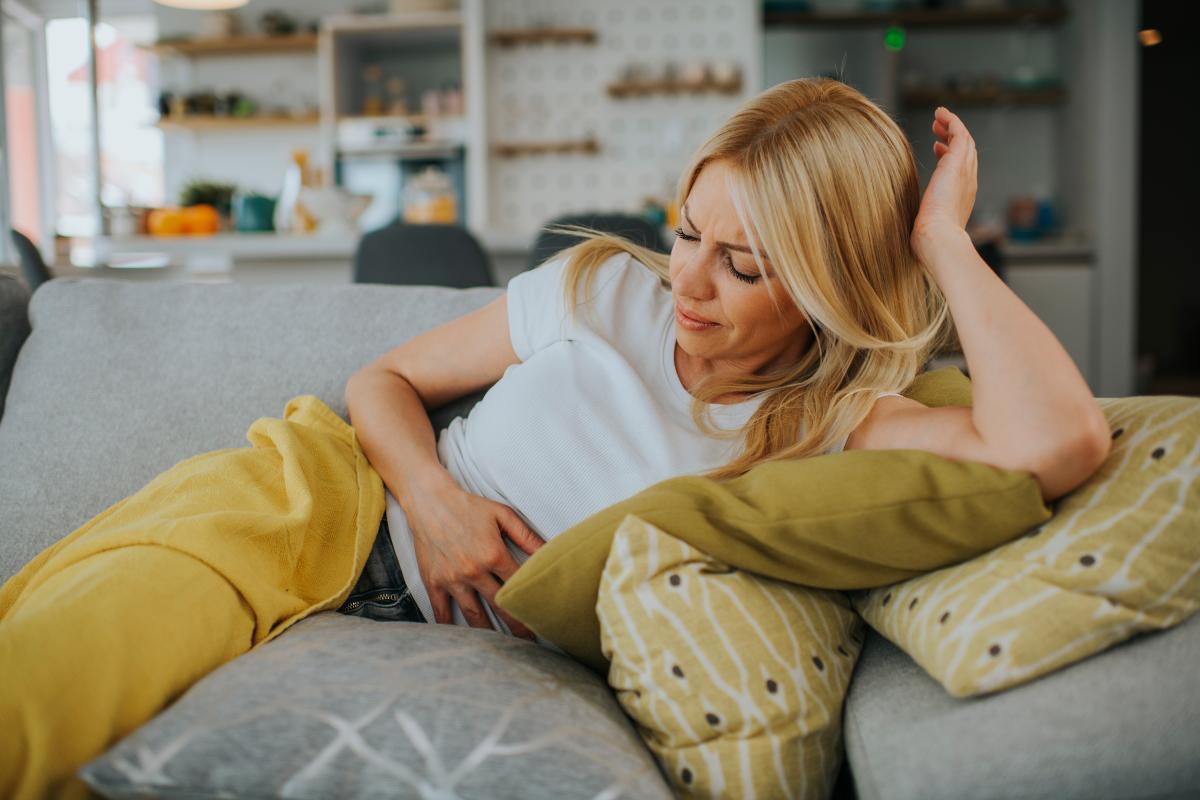 Woman showing signs of discomfort with endo pelvic pain