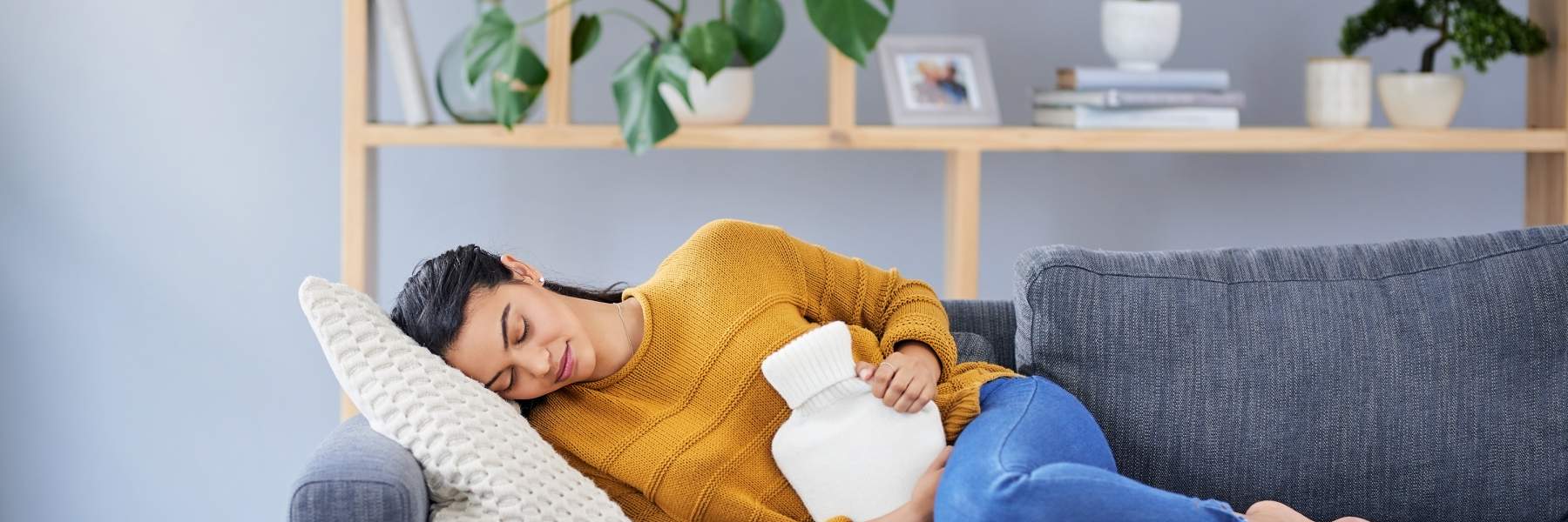 Applying hot water bottle for endo pain