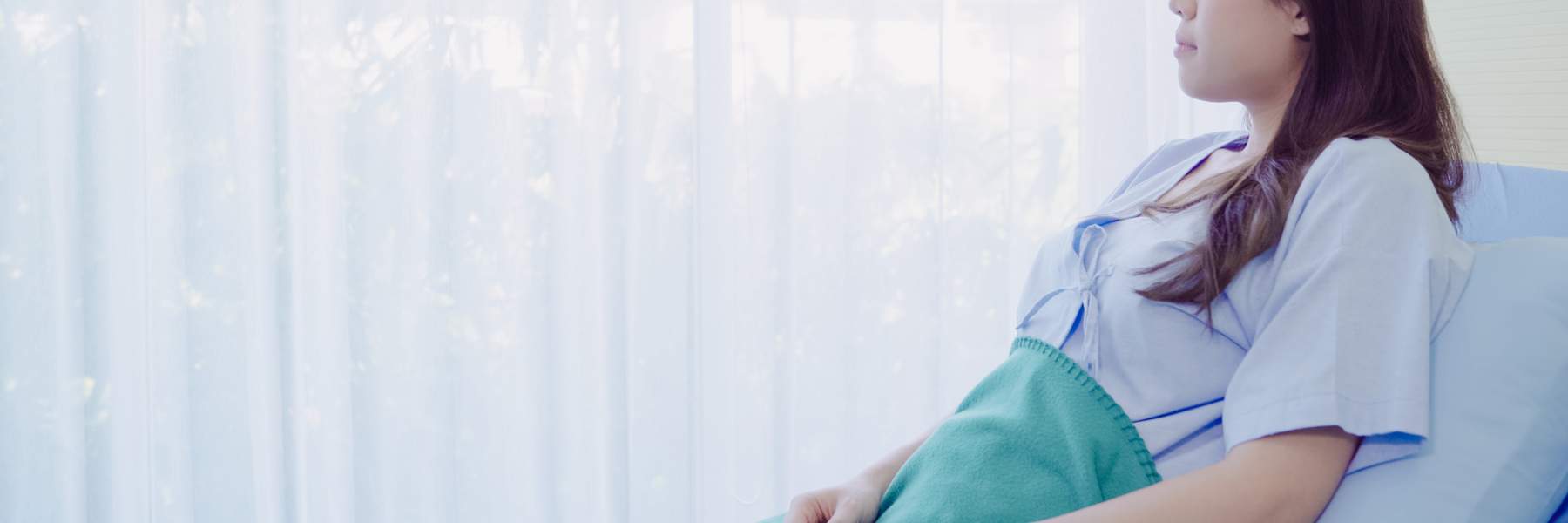 Give sat in hospital bed recovering from bowel surgery