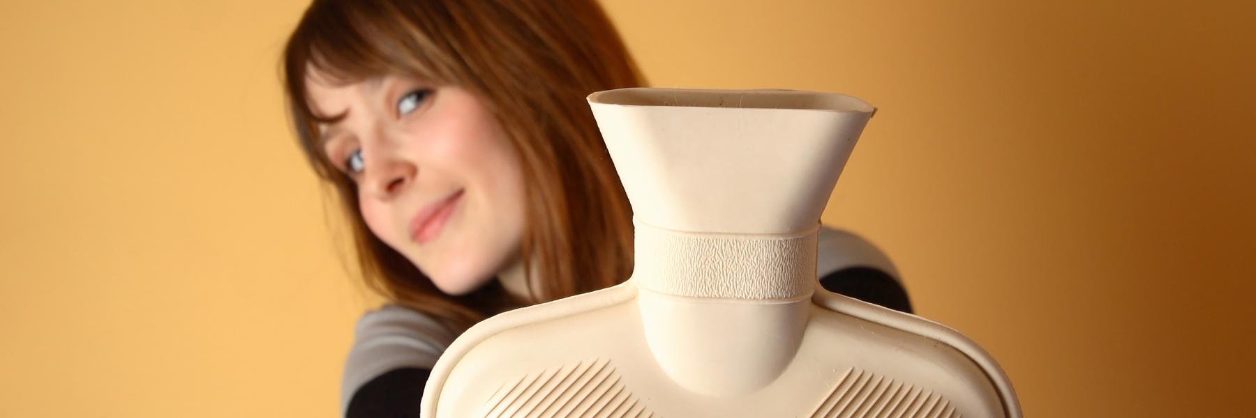 Woman holding water bottle to treat endometriosis