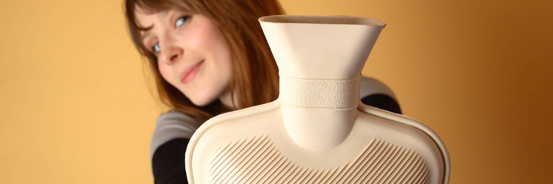 Woman holding water bottle to treat endometriosis