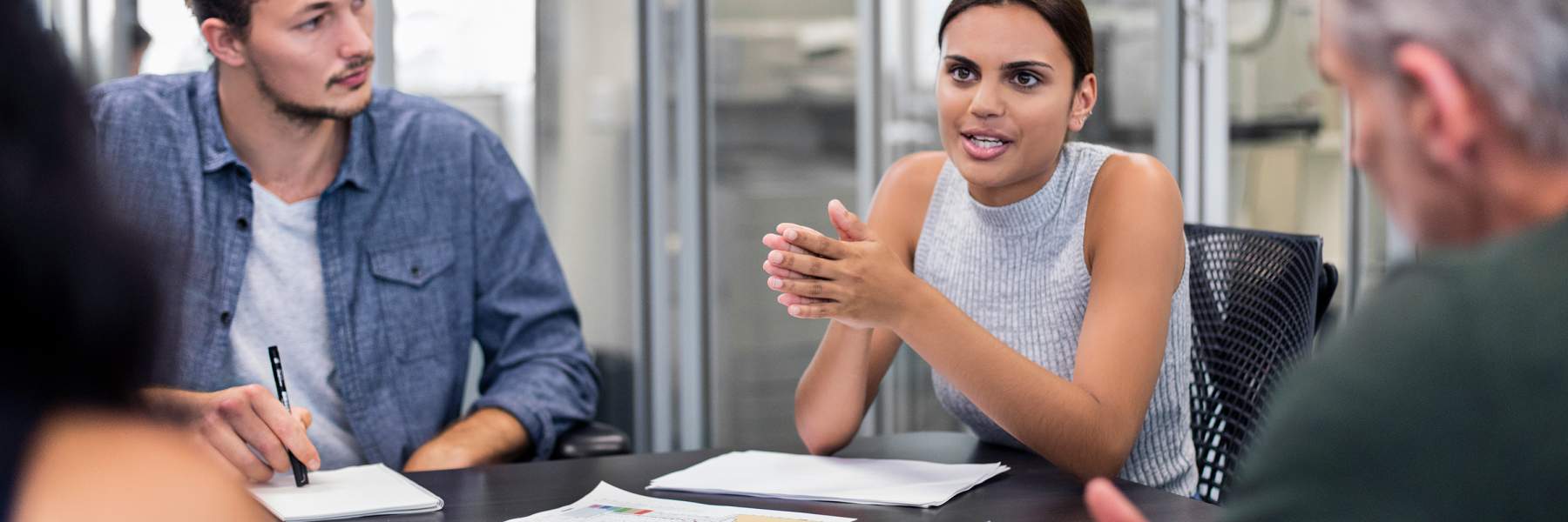 Woman at work meeting describing endo