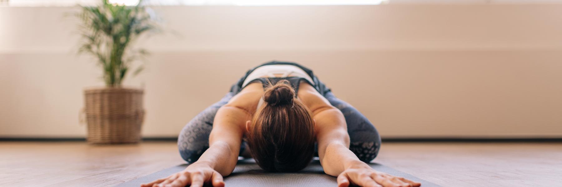 Woman doing gentle yoga stretches for endo