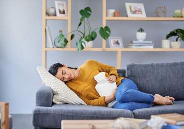 Applying hot water bottle for endo pain