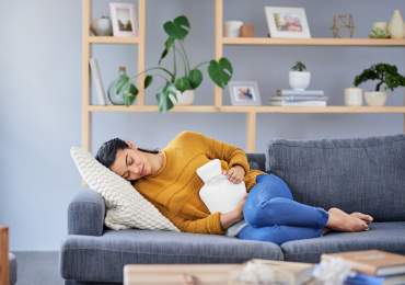 Applying hot water bottle for endo pain