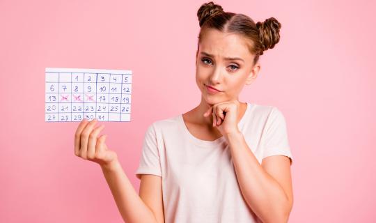 Girl tracking periods in journal