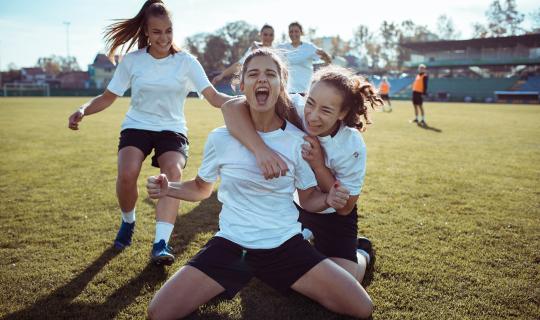 Young girls playing soccer