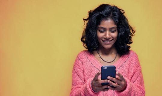 Young girl on phone looking for endo diagnosis