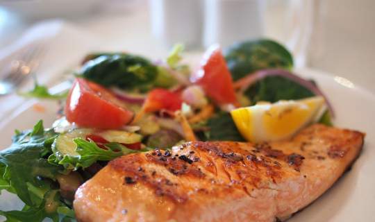 Salmon on a plate with salad